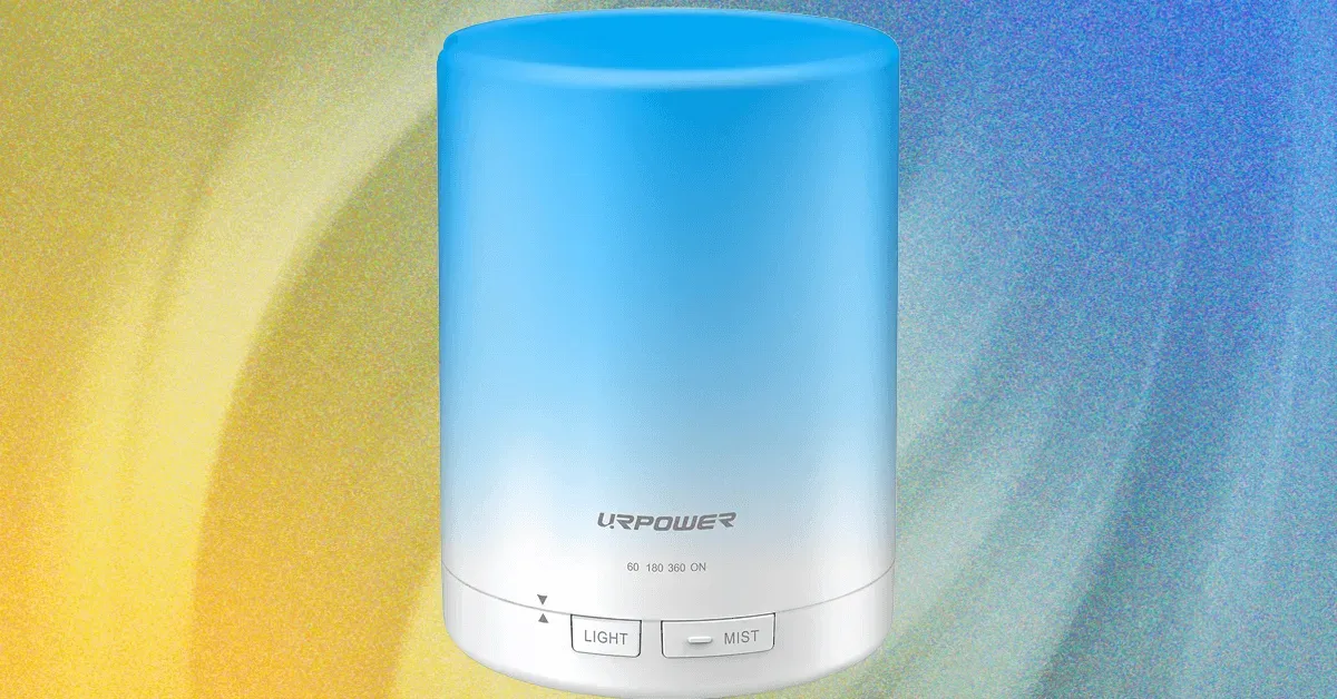 Smart scent diffusers on a countertop with app interface displayed on a phone