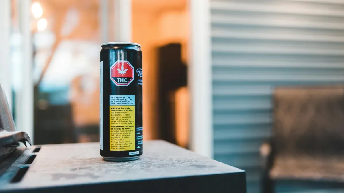 Cannabis-infused beverage next to wine glass, showing substitution effect