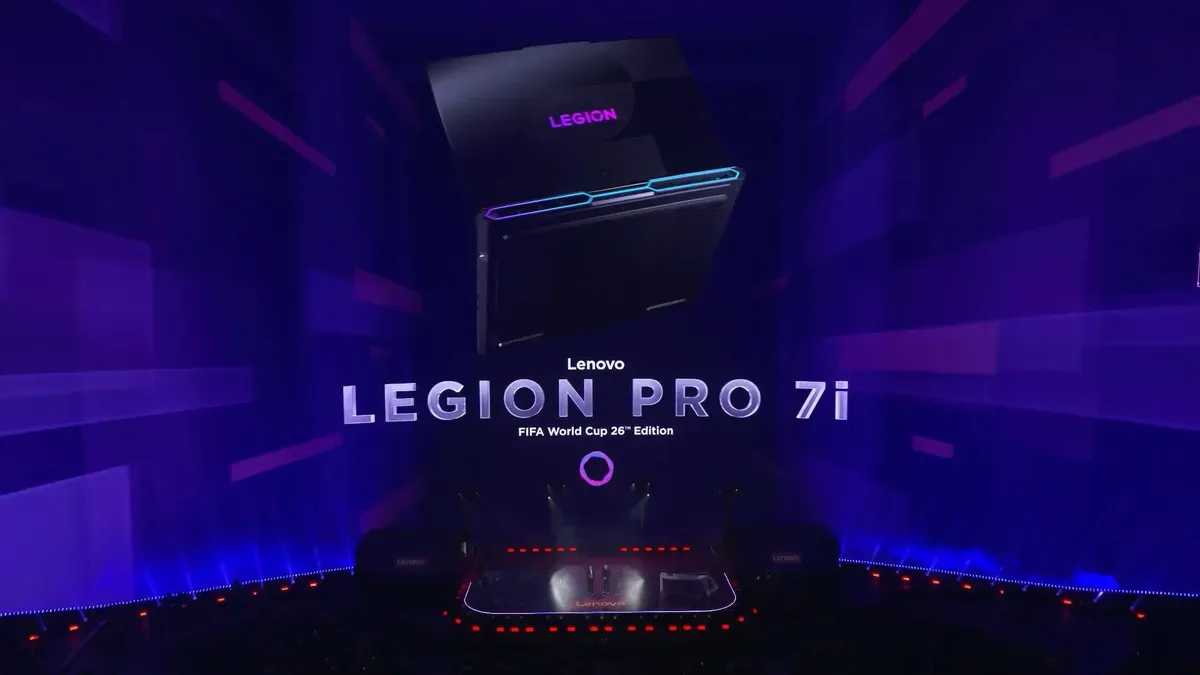 Lenovo's CES 2026 event at the Sphere with AI announcements and a FIFA-themed Legion Pro 7i laptop in the background