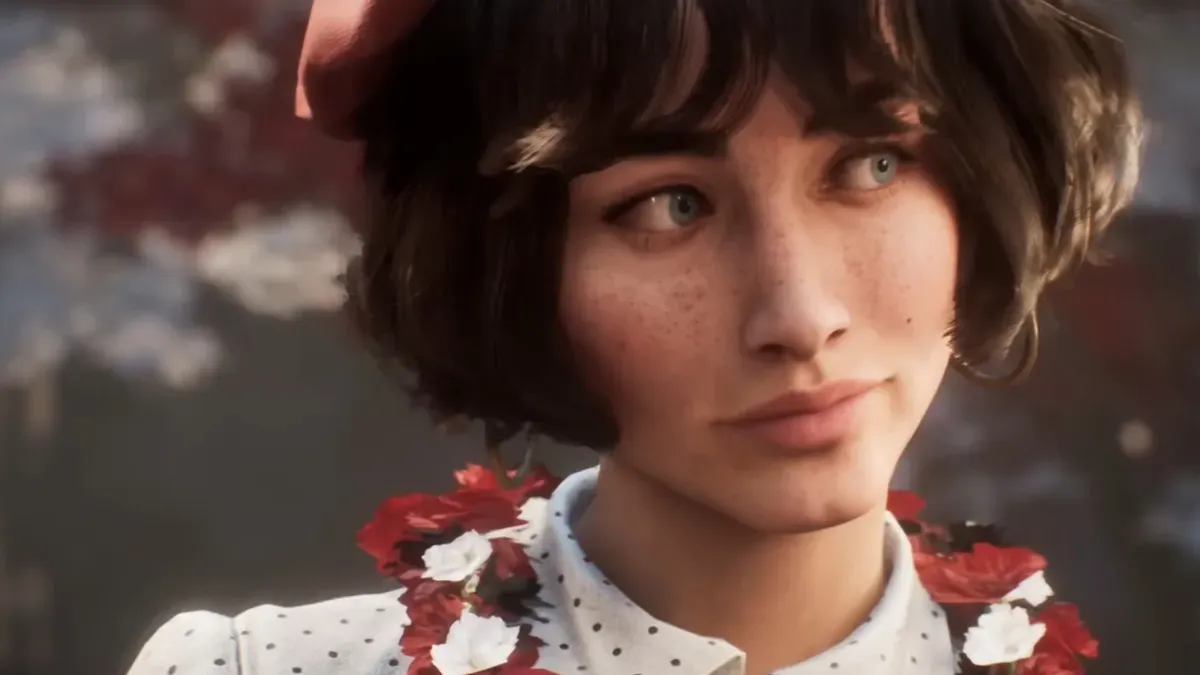 Clair Obscur: Expedition 33's GDCA award trophies displayed on a French-themed table with the Eiffel Tower in the background