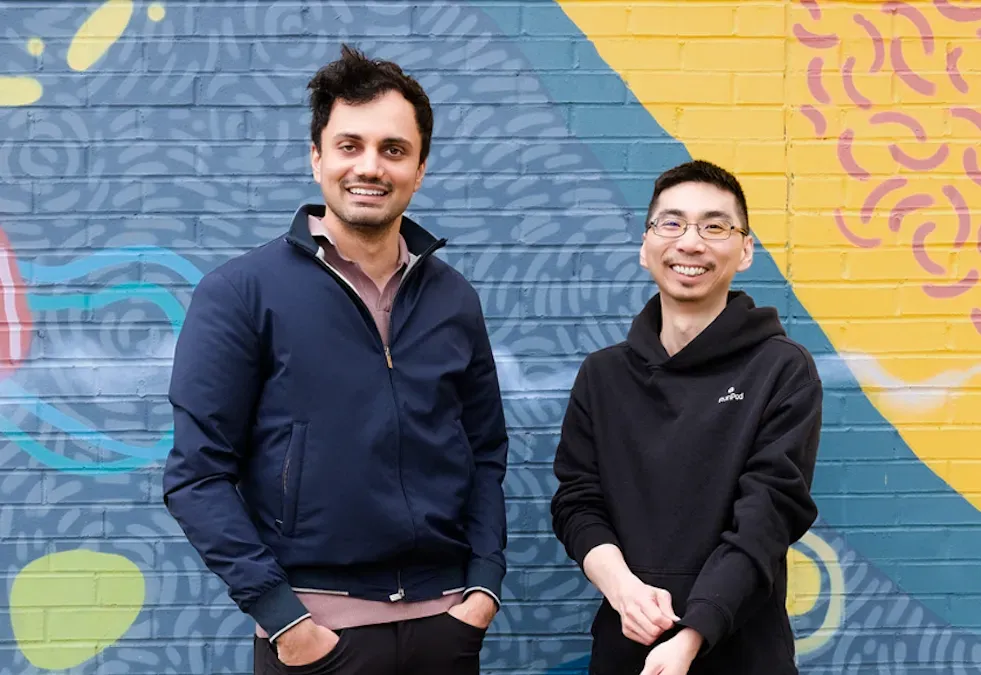 Runpod's founders Zhen Lu and Pardeep Singh in their office