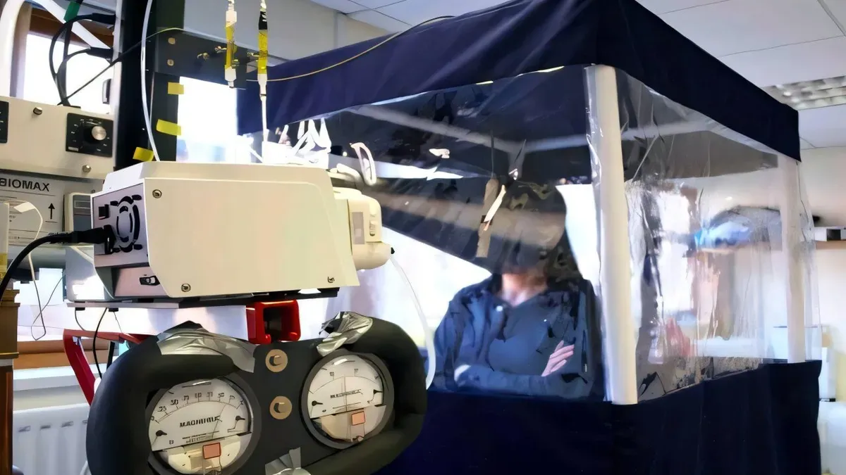 Scientists analyzing data from a flu transmission study in a controlled hotel environment