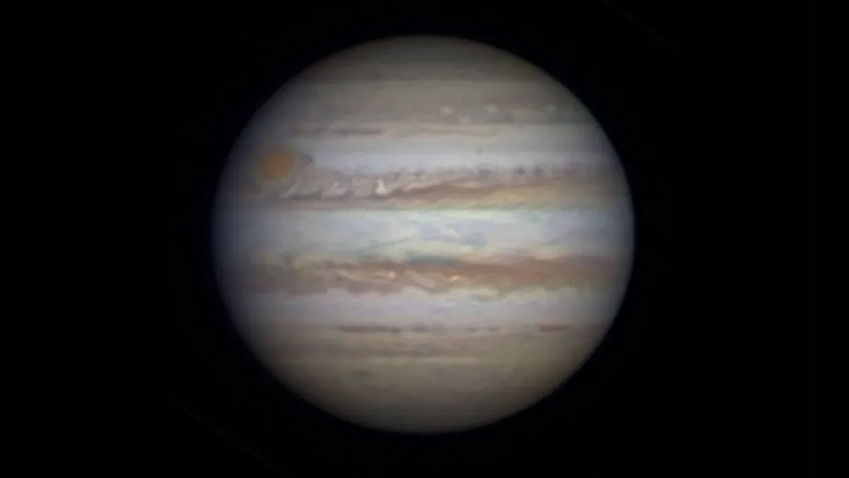 Jupiter at opposition with visible cloud bands and Galilean moons