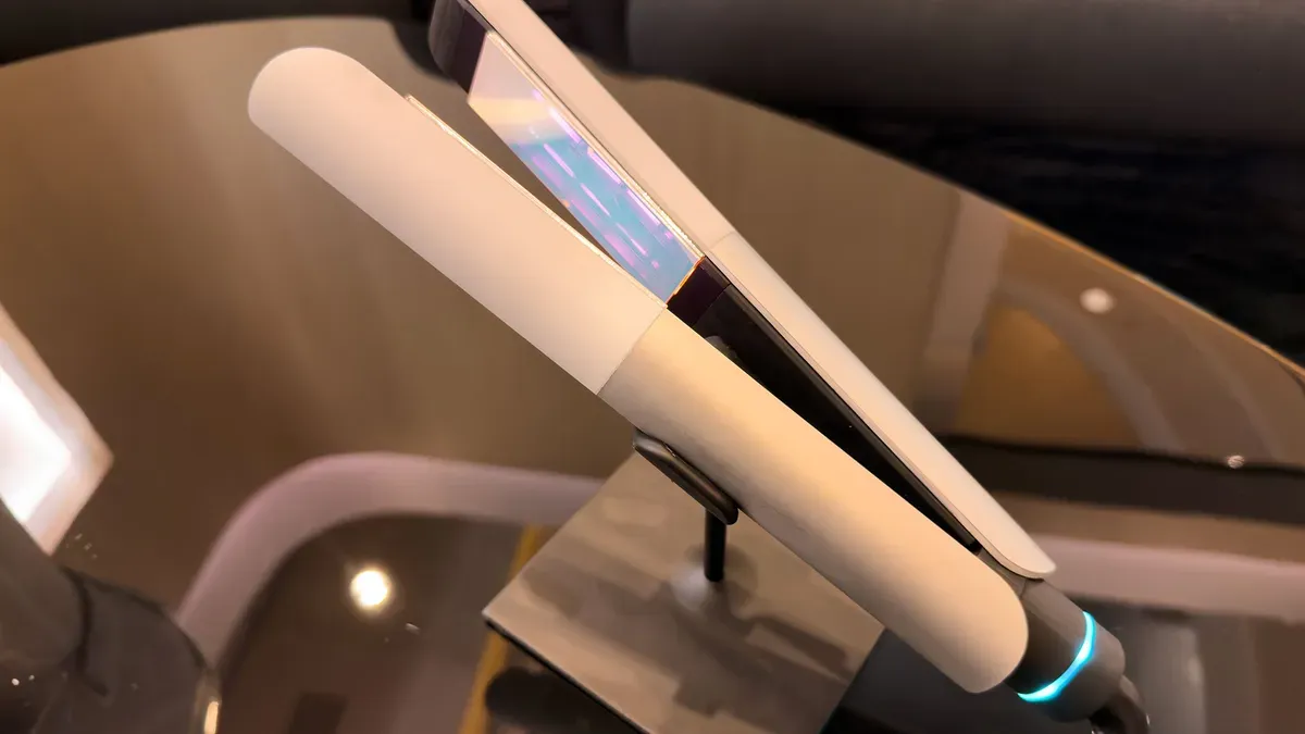 L’Oréal’s infrared flat iron on display at CES 2026 with robot arm demonstration
