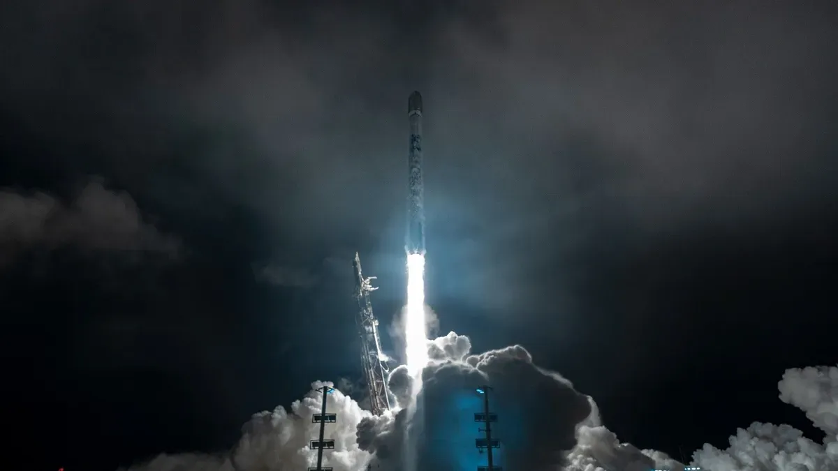SpaceX Falcon 9 rocket landing with Starlink satellites in orbit