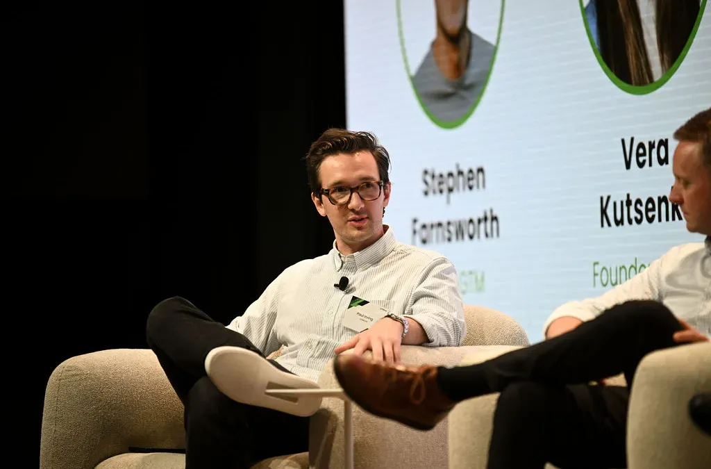 Startup founders discussing distribution strategies in a meeting