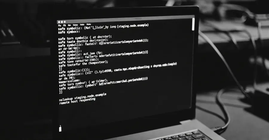 A diagram showing how DNS-based ClickFix attacks work, with nslookup commands triggering malicious payloads and blockchain-based delivery methods.